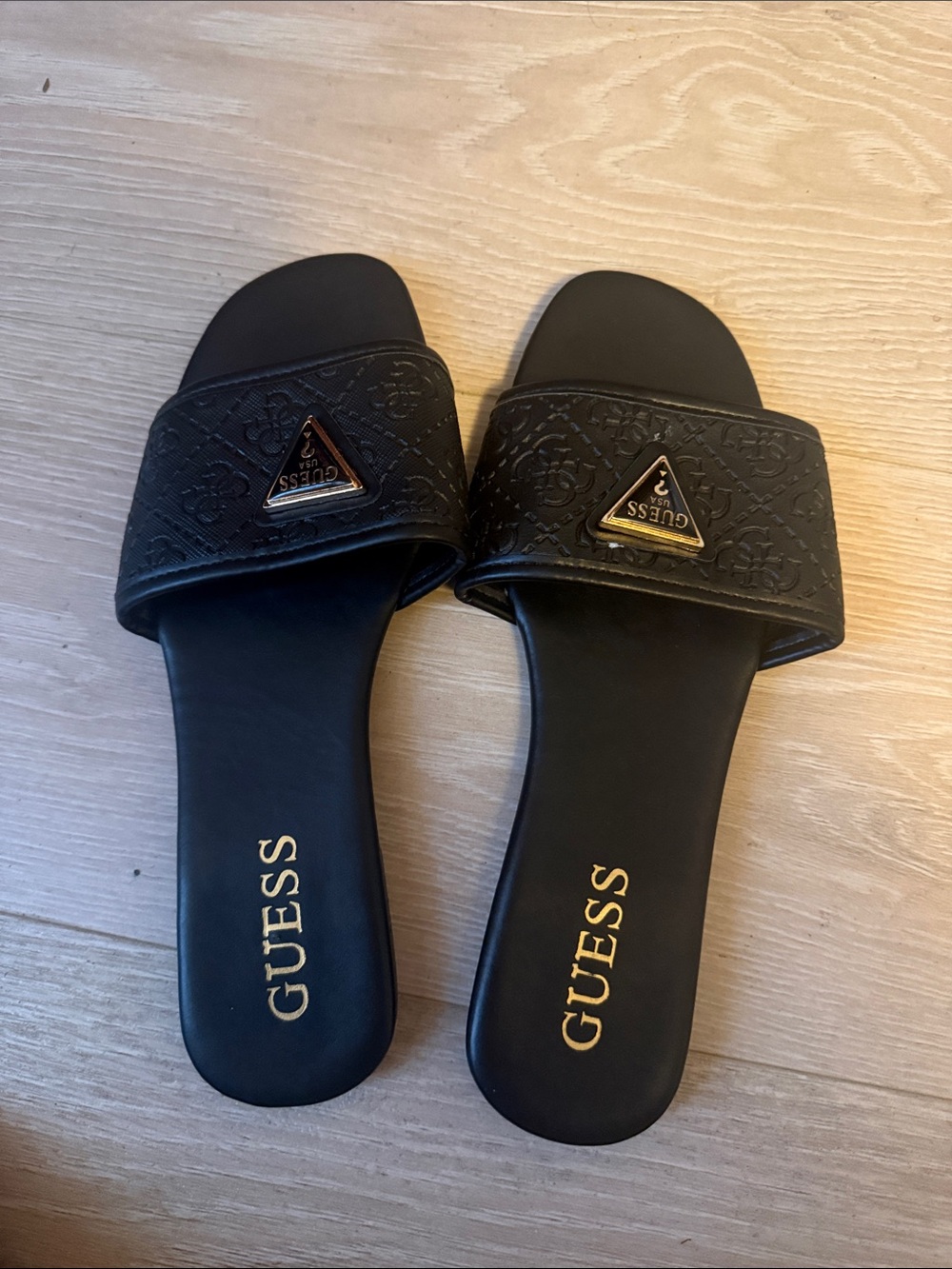 GUESS Black Slide Sandals with Gold Logo Triangle